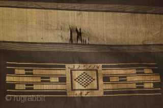 Late 19th-early 20th century Rishwan tribe hand loomed silk shawl woven in Homs, Syria.

For photos of this type of black and gold silk shawl/head dress being worn by elderly Rishwan women, the  ...