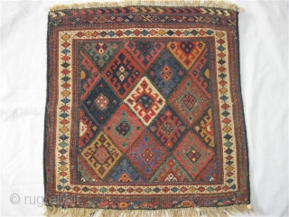 (127)Jaff Kurd pile panel-mid 19th C.57X54 cm
-see Tribal Rugs MacDonald plate 118 for similar. 

All vegetal colors (11)-including emerald green, aubergine, etc.Low pile, overcast sides, repaired closure slits.spot tinting.


price inc. shipment to  ...