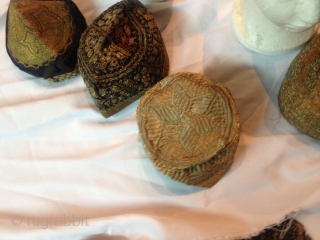 7antique Uzbek hats gold and silver embroidered.tirza mosaiof collection  some of the hats are jow wedding hats .all in god condition.ship free          