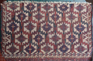 Fragment of an old, rare and colorful turkmen asmalyk (89 cm. x 55 cm.) Very fine weaving with asymmetrical knotting open to the right. Spacious drawing with incredible deep old colors. 3  ...