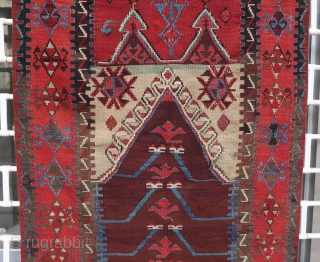 Old and beautiful Konya area "Tulip" kilim (179 cm x 102 cm). Very good dyes, with an especially shimmering red. Good condition for its age, 2 small repairs in the upper corners.  ...