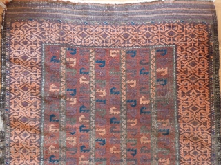 Old Baluch rug of a rare type. 
Complete with skirts. Damages to the selvedges and some wear in the field. Extraordinary complex border and appealing field including some aubergine color.
144cm x 85cm

 