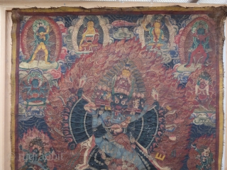 Antique, tibetan or nepalese Thangka painting, of the deity Mahottara Heruka in consort with Krodheshvari, central figure of the seven tiered, wearing a tiger's skin, trampling multiple figures under each foot, with  ...