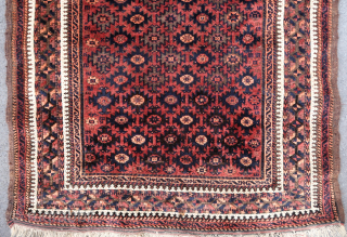Fine and old beautiful red ground baluch rug (193 cm. x 102 cm.)
This rug is in very good condition, with beautiful saturated colors including much purple. 
Fine weave, beautiful wool and dyes.  ...
