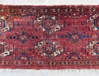 Beautiful and old Tekke torba (88,5 cm. x 34 cm.) Great wool, dyes, spacing, fineness and rare border. Surely older than most, but some moth damages and after an ink stain removal,  ...