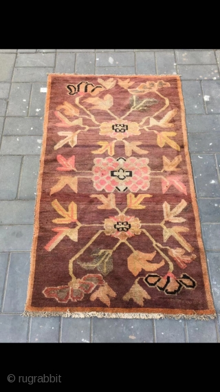 Tibetan rug, camel background with three flowers veins. Good age . Size 92*163cm(36*164”)                    