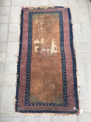 Tibetan rug, brown background with single group flower pattern, it was produced in Mid qing dynasty. Wool warp and weft. Size 75*150cm(29*58”)           