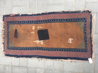 Tibetan rug, brown background with single group flower pattern, it was produced in Mid qing dynasty. Wool warp and weft. Size 75*150cm(29*58”)           
