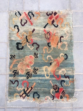 Tibetan rug, moon blue background with Chinese eight treasure veins. About mid Qing Dynasty, good age. The row knitting very tightly . Size 61*86cm( 24*34”)        