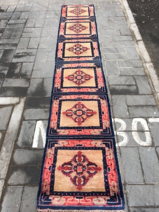 Ningxia runner carpet, six joined mats, light camel background with Buddha turns wheel veins. Very good age and condition.size 355*60cm(138*23”)             