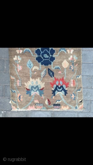 Tibetan rug, light camel background with nice peony flower pattern. Good age and condition. Size 138*88cm(54*34”)                 