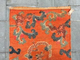 Tibetan rug, Orange background with bat pattern, surrounded by the bat veins. Very nice rug, good age and condition. Size 88*60cm(34*23”)            