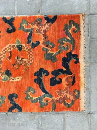 Tibetan rug, Orange background with bat pattern, surrounded by the bat veins. Very nice rug, good age and condition. Size 88*60cm(34*23”)            