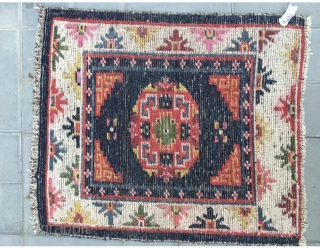 Tibetan rug, blue background with single group flower pattern. Wool warp and weft. Late Qing Dynasty. Good age and condition.63*76cm(25*30”)             