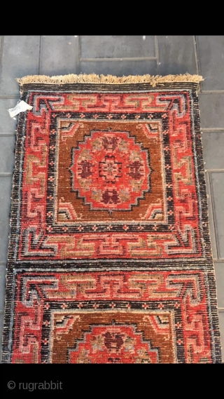 Tibetan rug, re color and three joined with single group flower pattern. Wool warp and weft. Late Qing Dynasty. Good and condition. Size 68*190cm(27*74”)         