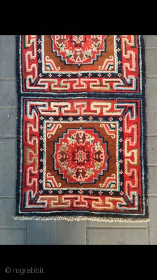 Tibetan rug, re color and three joined with single group flower pattern. Wool warp and weft. Late Qing Dynasty. Good and condition. Size 68*190cm(27*74”)         