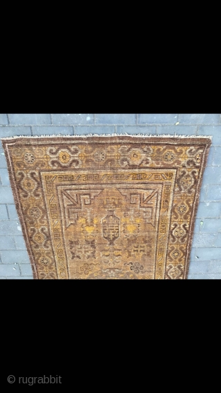 #2023 Xinjiang carpet. It was produced in Khotan area. Late 19th / circa 1900. Brown background with Xinjiang Khotan flowers pattern, some early synthetic color . Wool weft and cotton warp. Size  ...