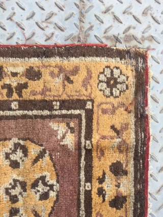 Chinese rug, it was produced in Gansu province. Very rare. Camel background with single group flower veins. Good age.size 63*63cm(25*25”)             