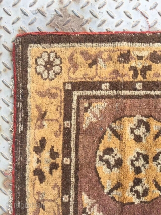 Chinese rug, it was produced in Gansu province. Very rare. Camel background with single group flower veins. Good age.size 63*63cm(25*25”)             