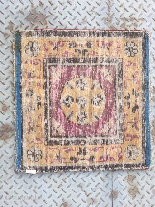 Chinese rug, it was produced in Gansu province. Very rare. Camel background with single group flower veins. Good age.size 63*63cm(25*25”)             