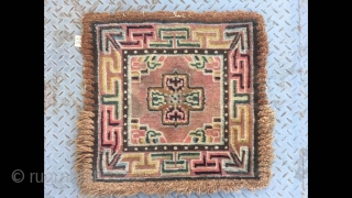 Tibetan rug, square seating rug, wool warp and weft.single cross flower with lucky cloud veins. About mid Qing Dynasty, good condition no any repair. Size 66*66cm(26*26”)       