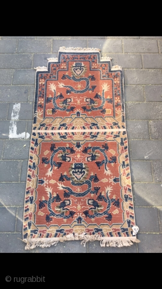 #2029 Baotou rug, it was produced in Baotou area in Inner Mongolia. A sit mat with back. Red background with lively dragon pattern, lucky cloud salvage. Good age and quality. Size 145*75cm(57*29") 