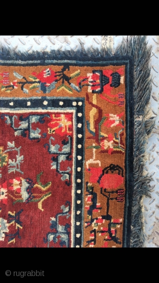 Tibetan rug, red background with colorful flower and grass pattern. Good age and condition. Size 165*88cm(64*34”)                 