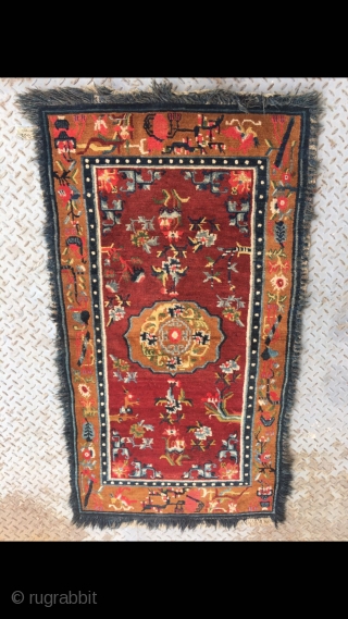 Tibetan rug, red background with colorful flower and grass pattern. Good age and condition. Size 165*88cm(64*34”)                 