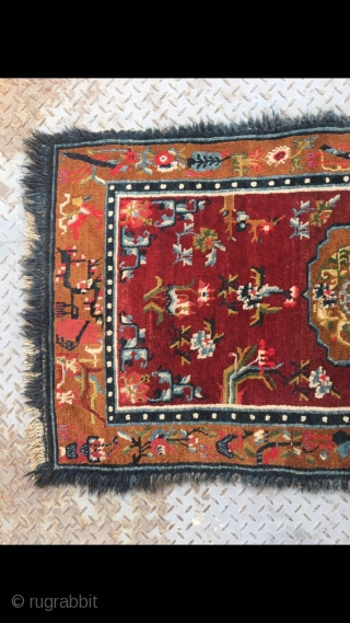 Tibetan rug, red background with colorful flower and grass pattern. Good age and condition. Size 165*88cm(64*34”)                 