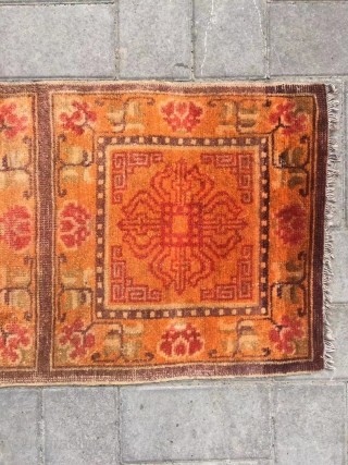 Ningxia rug, orange color with Buddha wheel veins. It was produced in early 20th century. Good age and condition. Size 60*165 cm(23*164”)           