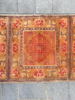 Ningxia rug, orange color with Buddha wheel veins. It was produced in early 20th century. Good age and condition. Size 60*165 cm(23*164”)           