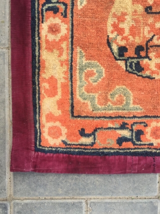 #2047 Baotou rug, lama sitting mat, orange background with single group flower veins, around  lucky cloud and with flower selvage. Good age and quality. Size 55*55cm(21*21")      