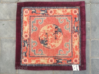 #2047 Baotou rug, lama sitting mat, orange background with single group flower veins, around  lucky cloud and with flower selvage. Good age and quality. Size 55*55cm(21*21")      