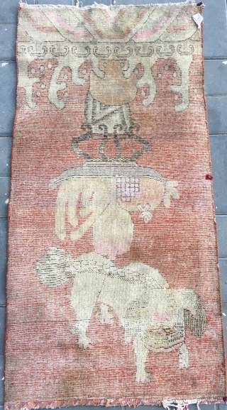 Chinese Xinjiang Khotan rug, red background with very rare lion pattern. About 1930. Good condition. Size 75*146cm(29*58”)                