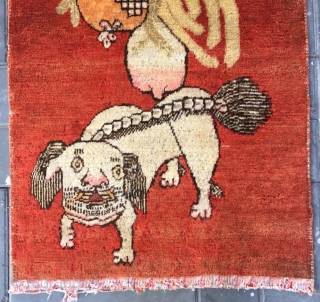 Chinese Xinjiang Khotan rug, red background with very rare lion pattern. About 1930. Good condition. Size 75*146cm(29*58”)                