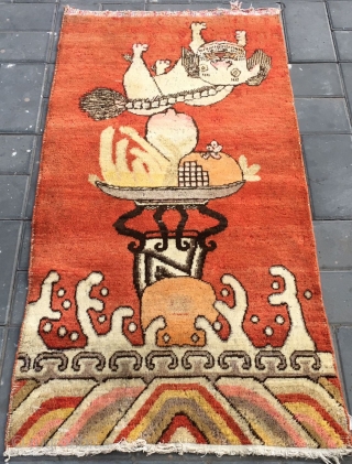 Chinese Xinjiang Khotan rug, red background with very rare lion pattern. About 1930. Good condition. Size 75*146cm(29*58”)                