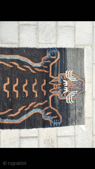 #2058 Tibet rug, dark blue color with tiger pattern, wool warp and weft. No any repair. Good age. Size 135*65cm (53*25")

rugrabbit note: This is a fake / contemporary piece    