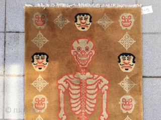 Fake Tibetan rug, light camel background with skeleton pattern. Good condition. Size 172*87cm(67*34”)                    