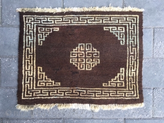 #2065 Tibet rug, brown background with single group pattern, Hui veins selvage. Wool warp and weft. Good age and quality quality. Size 60*47cm (23*18")         