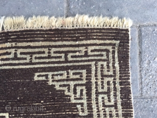 #2065 Tibet rug, brown background with single group pattern, Hui veins selvage. Wool warp and weft. Good age and quality quality. Size 60*47cm (23*18")         