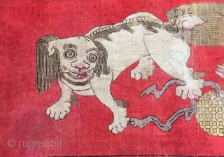 Chinese Xinjiang rug, red background with  little lion pattern, fruit veins selvage, the pronunciation of “tai Shi”, means an official position in ancient China. Good age and condition. Size 180*285cm(70*111”)  