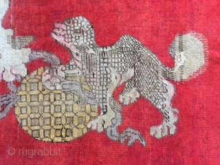 Chinese Xinjiang rug, red background with  little lion pattern, fruit veins selvage, the pronunciation of “tai Shi”, means an official position in ancient China. Good age and condition. Size 180*285cm(70*111”)  