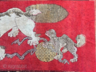 Chinese Xinjiang rug, red background with  little lion pattern, fruit veins selvage, the pronunciation of “tai Shi”, means an official position in ancient China. Good age and condition. Size 180*285cm(70*111”)  