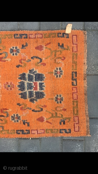 Tibetan rug, orange color with Buddha eight treasures pattern. Wool warp and weft. Size 145*73cm(56*28”)                  