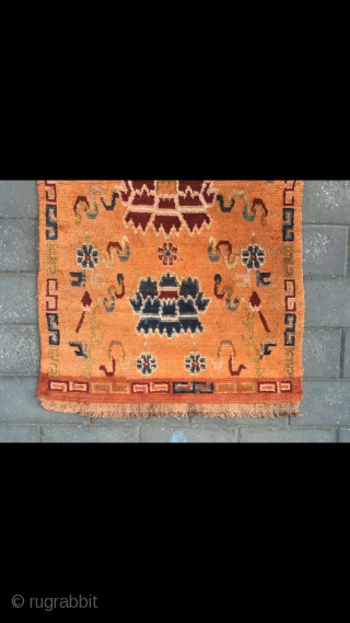 Tibetan rug, orange color with Buddha eight treasures pattern. Wool warp and weft. Size 145*73cm(56*28”)                  