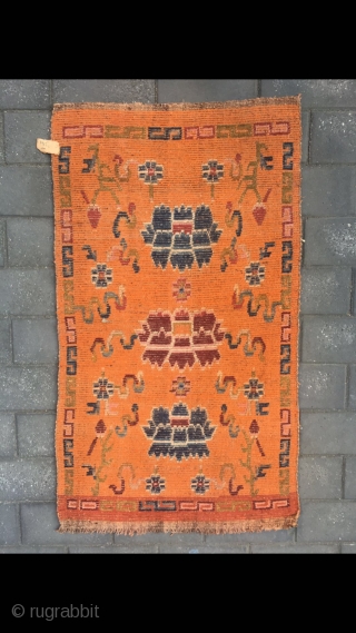 Tibetan rug, orange color with Buddha eight treasures pattern. Wool warp and weft. Size 145*73cm(56*28”)                  