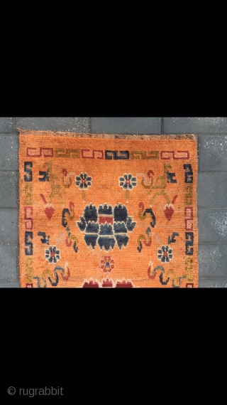 Tibetan rug, orange color with Buddha eight treasures pattern. Wool warp and weft. Size 145*73cm(56*28”)                  