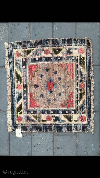 #2091 Tibet rug, camel background with single group flower with Buddha fingers veins. Flower selvage. Good age and quality. Size 58*61cm( 23*24")           