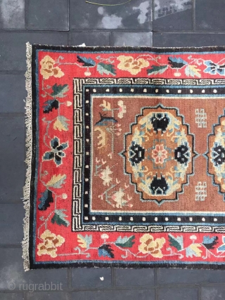 Tibet rug, camel background with three group flowers pattern, around red color full flower selvage. Size 152*83cm(59*32”) wool warp and weft. Good age          