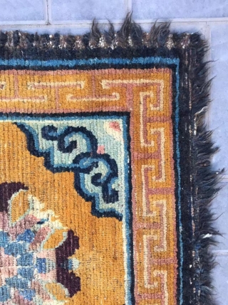 Tibet rug, yellow background with nice group flowers pattern, Lucky clouds  in the four corner. Good age and condition. Size 160*88cm(62*34”). Wool warp and weft       